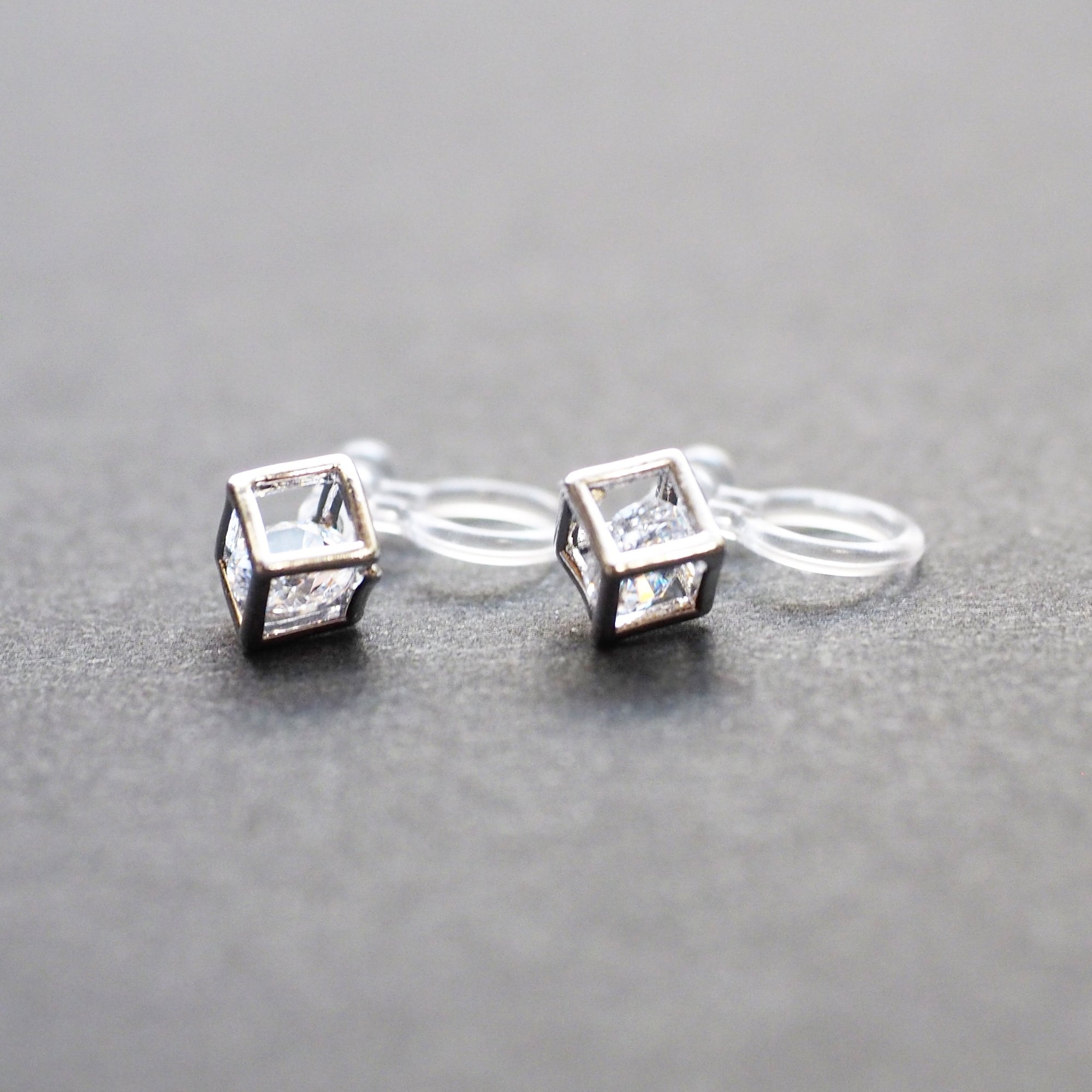 Cubic Zirconia Crystal In Cube Invisible Clip On Stud Earrings ( Silver tone ) - Miyabi Grace