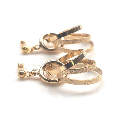 Three metallic gold rings invisible clip on earrings - miyabigracejewelry.com