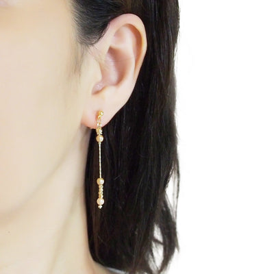 Dangle orange pearls & gold chain invisible clip on earrings - Miyabi Grace