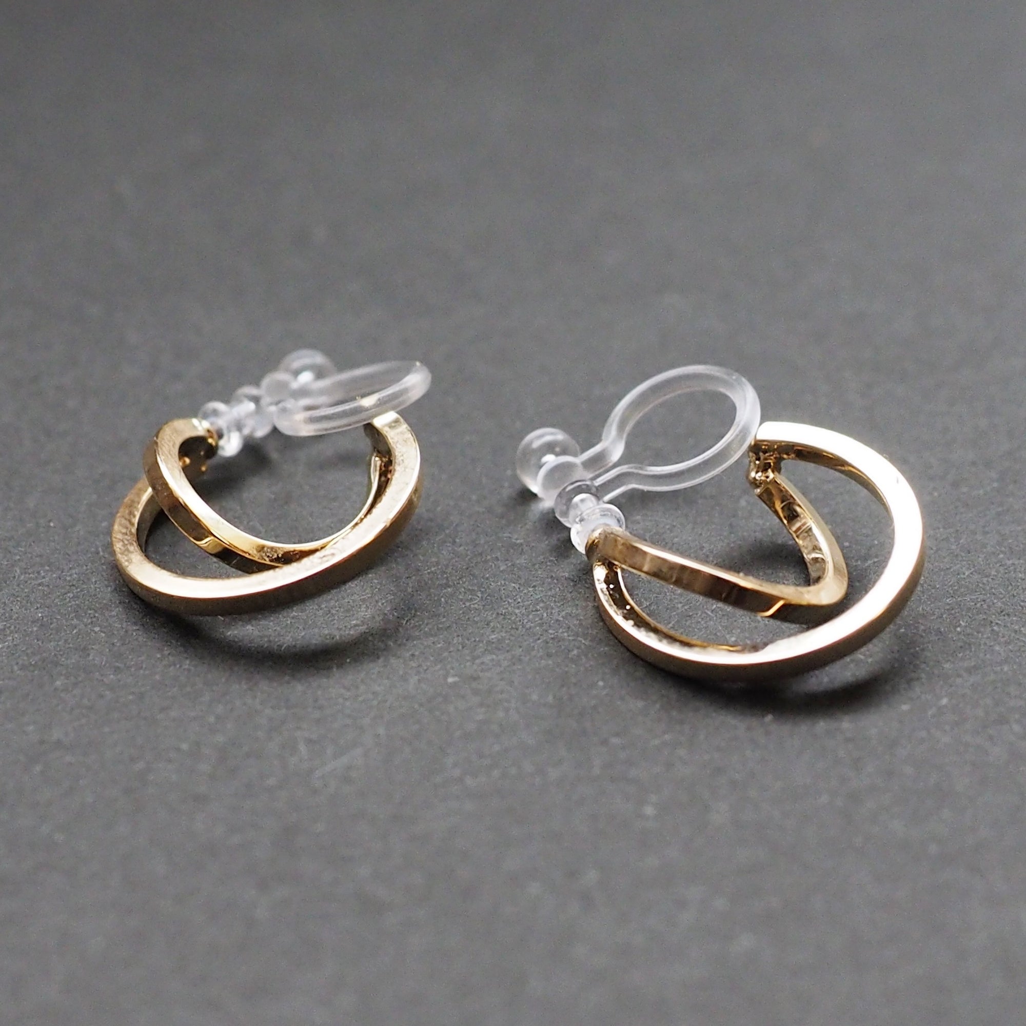 Gold Huggie Crossed Invisible Clip On Hoop Earrings - Miyabi Grace