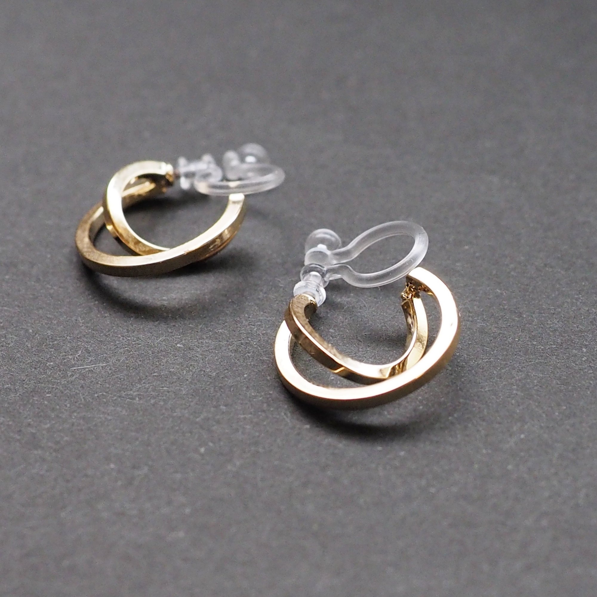 Gold Huggie Crossed Invisible Clip On Hoop Earrings - Miyabi Grace