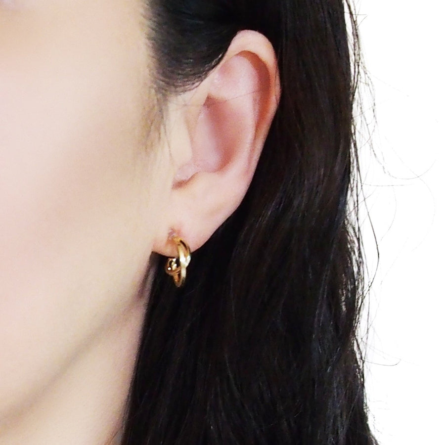 Gold Huggie Crossed Invisible Clip On Hoop Earrings - Miyabi Grace