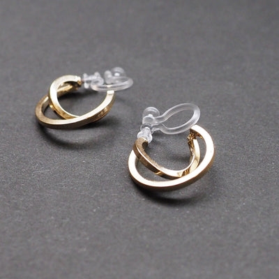 Gold Huggie Crossed Invisible Clip On Hoop Earrings - Miyabi Grace