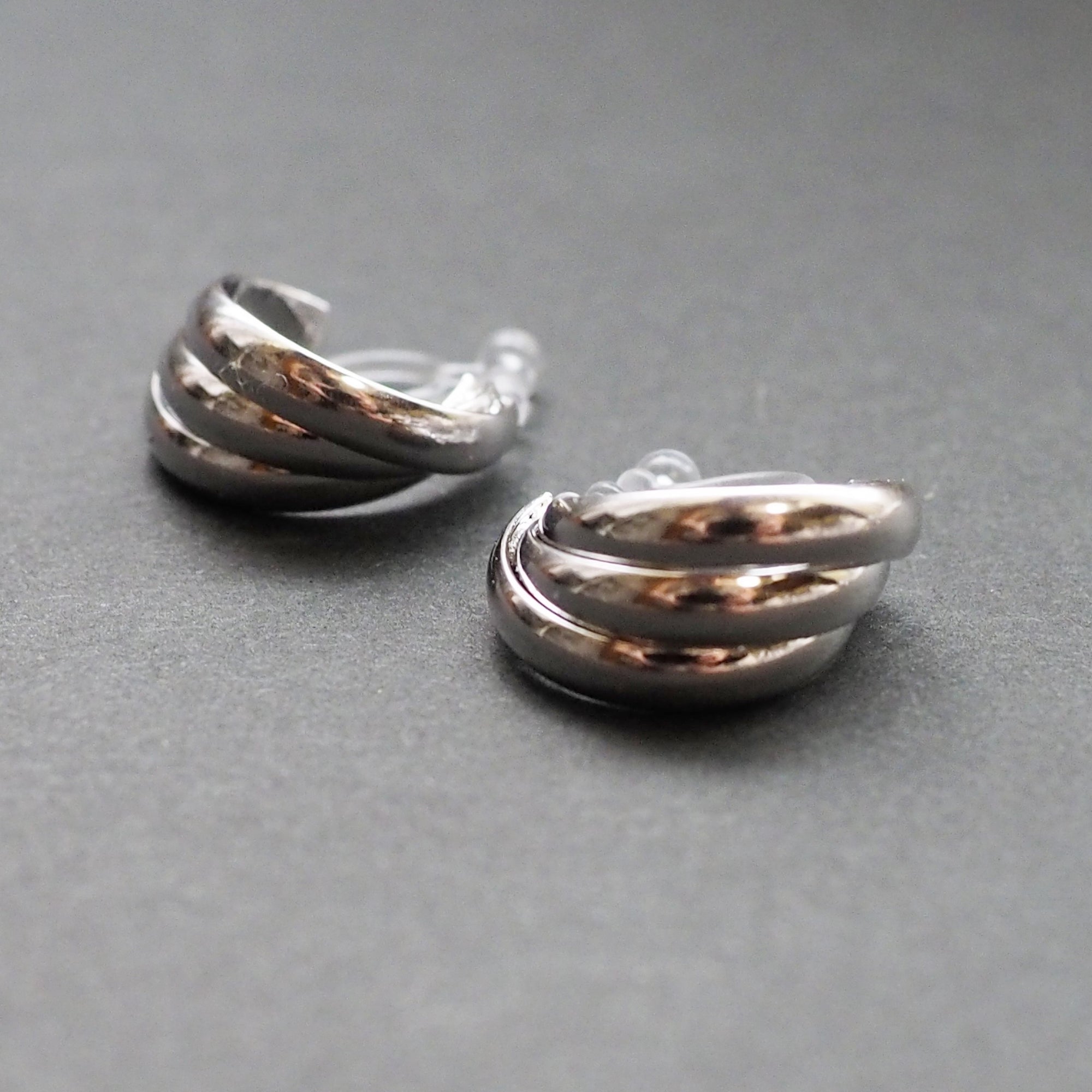 Silver Huggie Crossed Invisible Clip On Hoop Earrings - Miyabi Grace