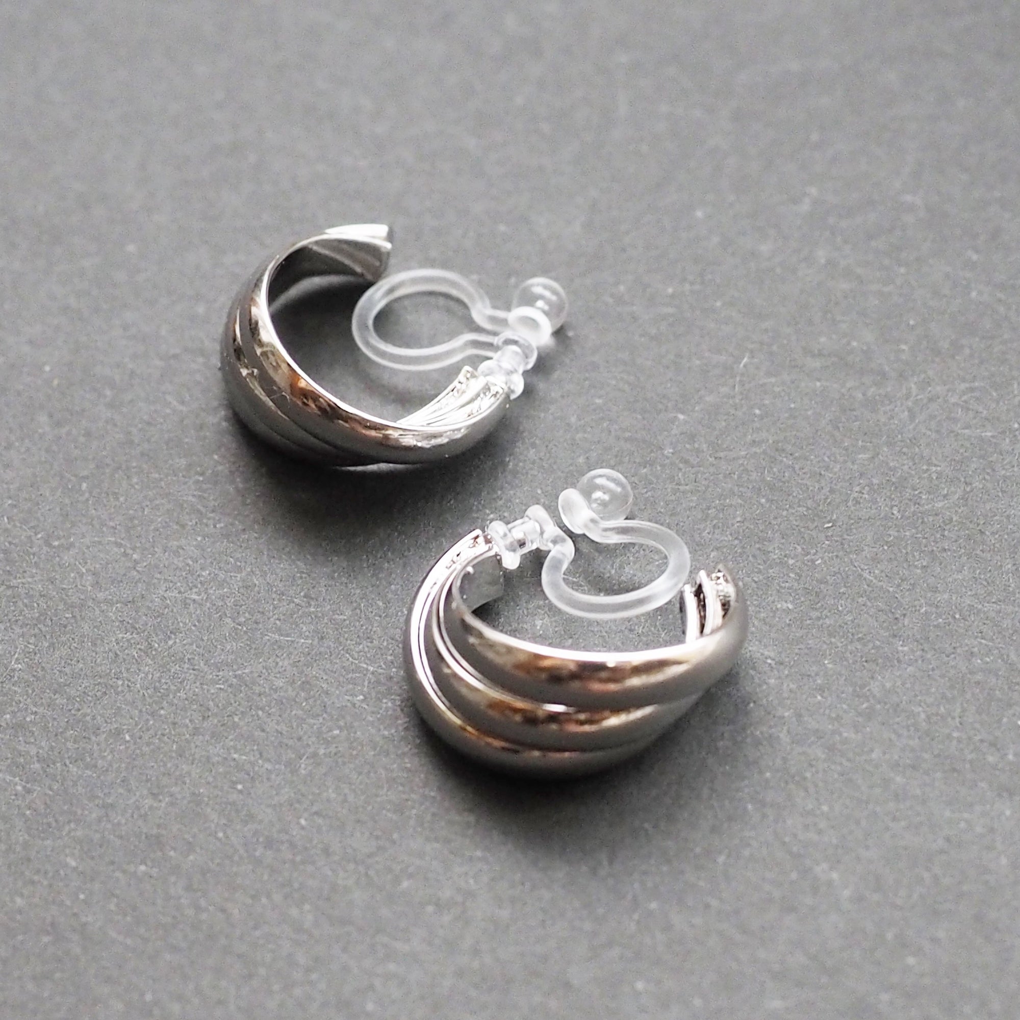 Silver Huggie Crossed Invisible Clip On Hoop Earrings - Miyabi Grace