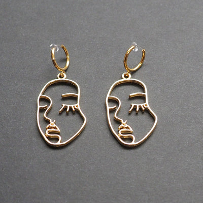 Gold human face clip on hoop earrings - Miyabi Grace