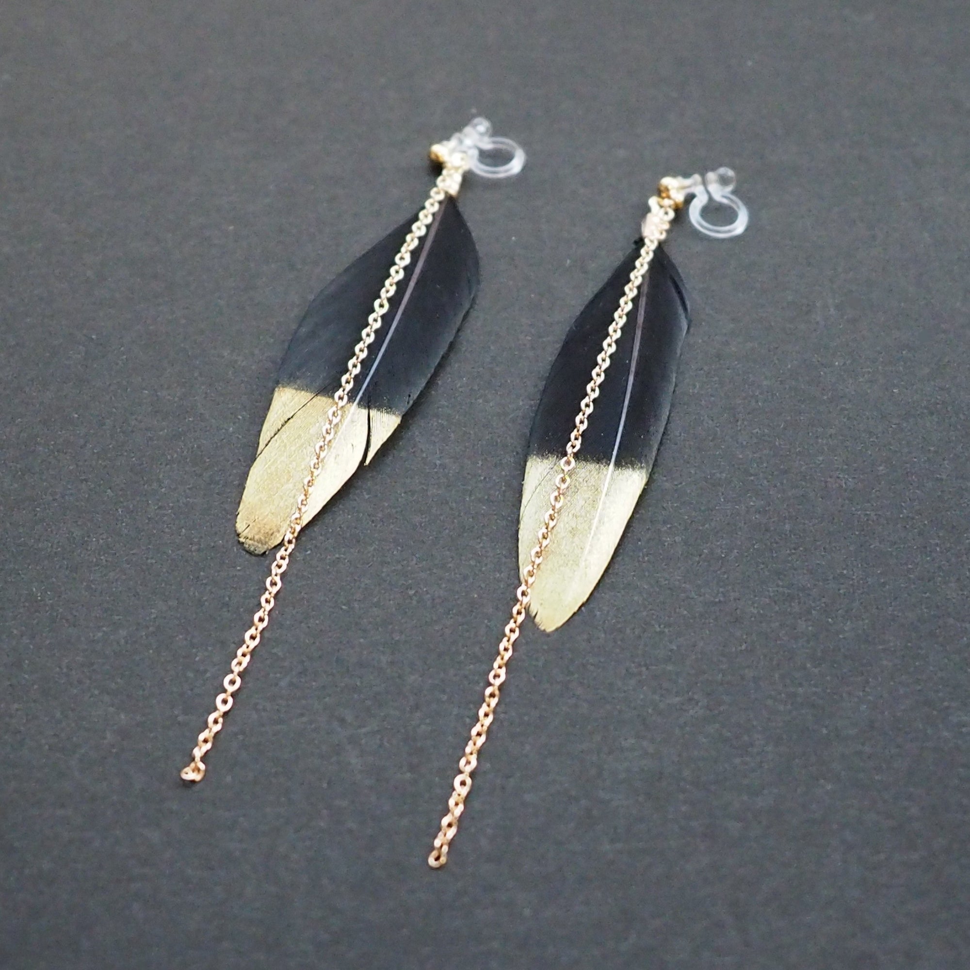 Gold painted black feather invisible clip on earrings - Miyabi Grace