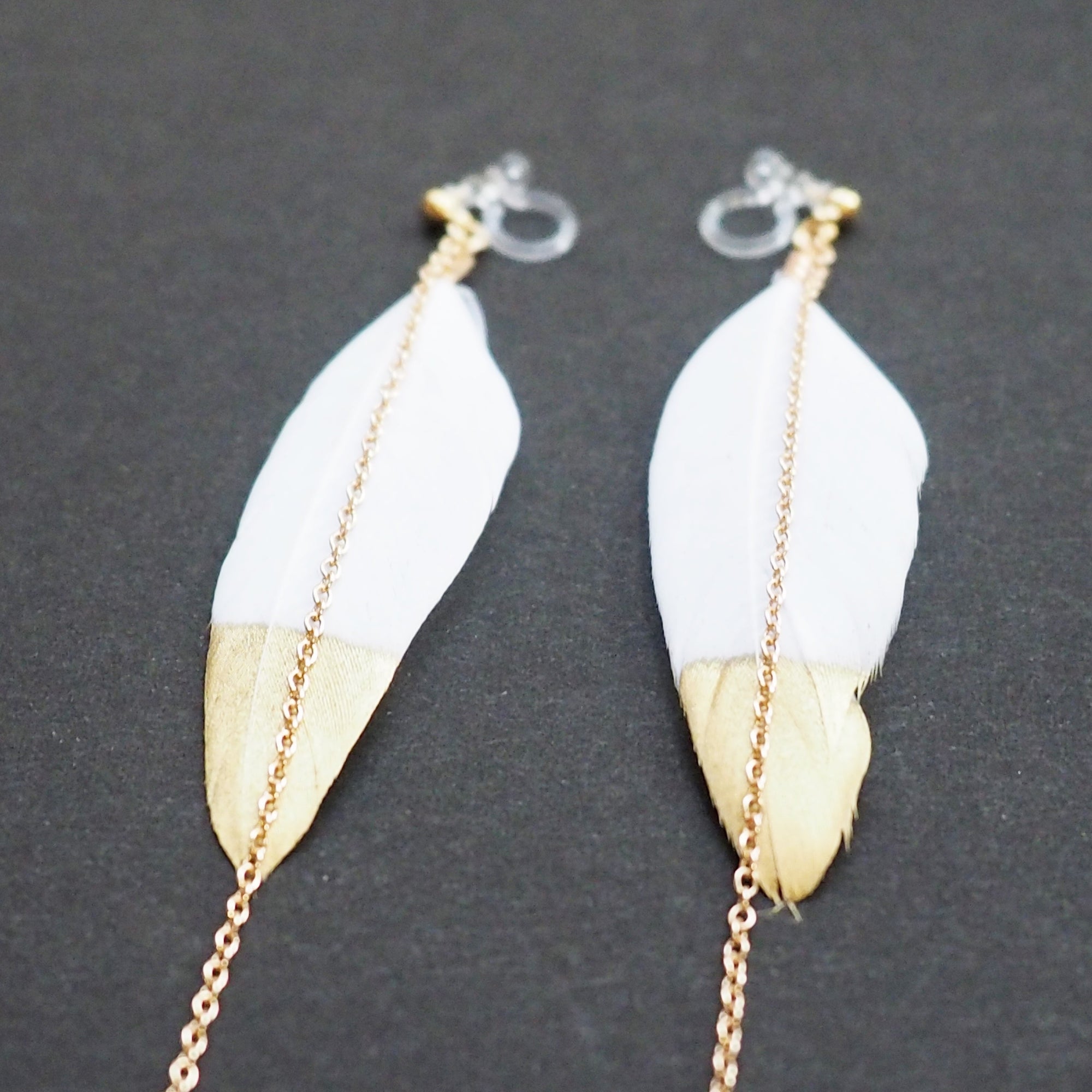 Gold painted white feather invisible clip on earrings - Miyabi Grace