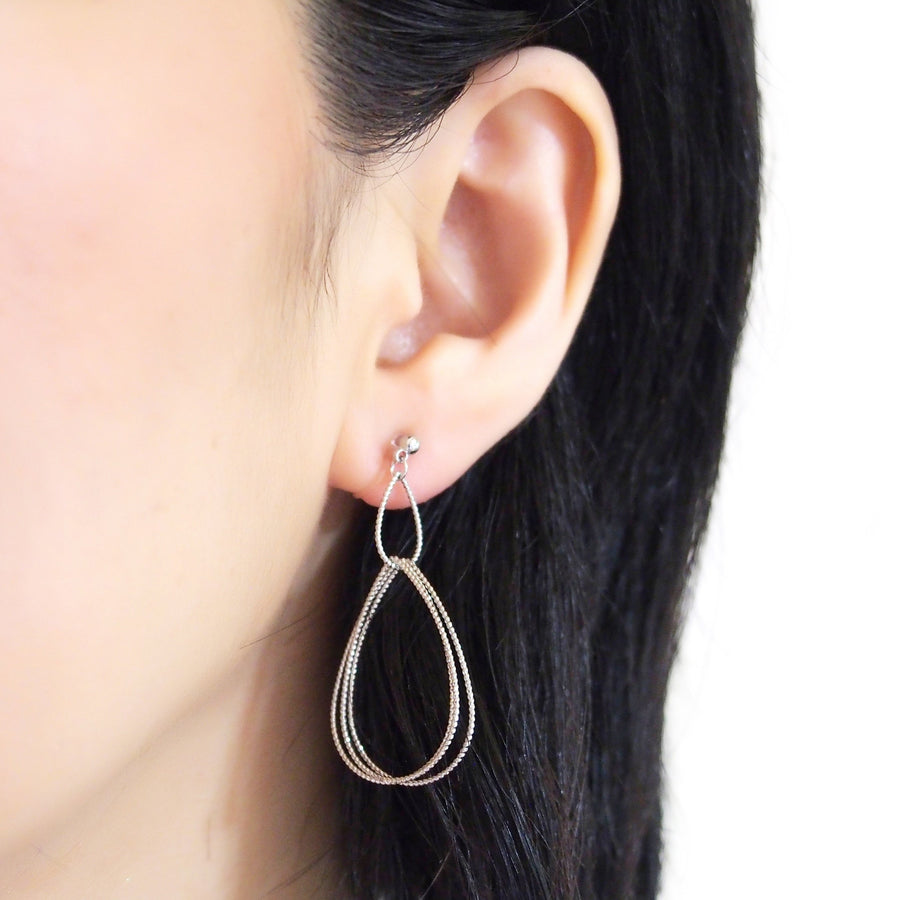 Dangle Silver Textured Pear Hoop Invisible Clip on Earrings - miyabigracejewelry.com