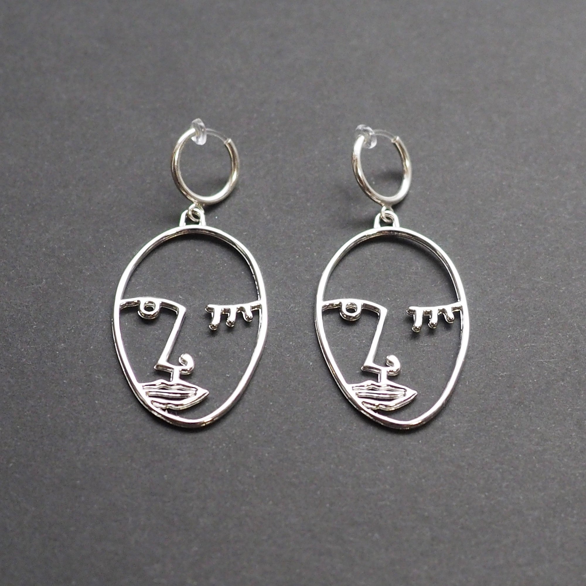 Silver Picasso human face clip on hoop earrings - Miyabi Grace