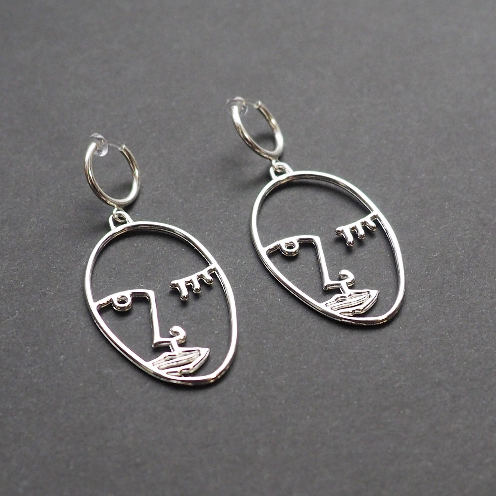 Silver Picasso human face clip on hoop earrings - Miyabi Grace