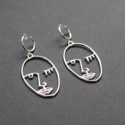 Silver Picasso human face clip on hoop earrings - Miyabi Grace