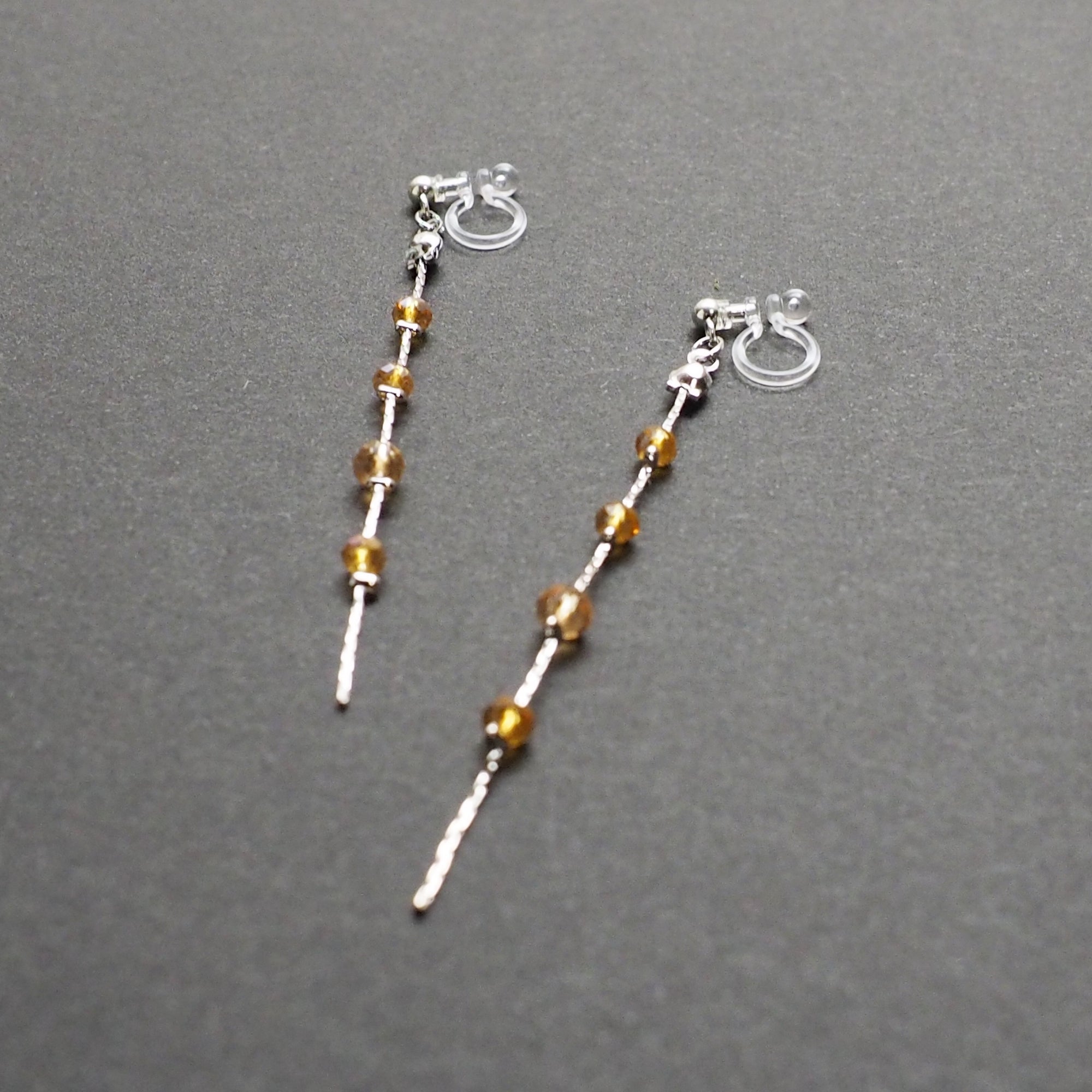 Dangle silver chain & orange crystal invisible clip on earrings - Miyabi Grace