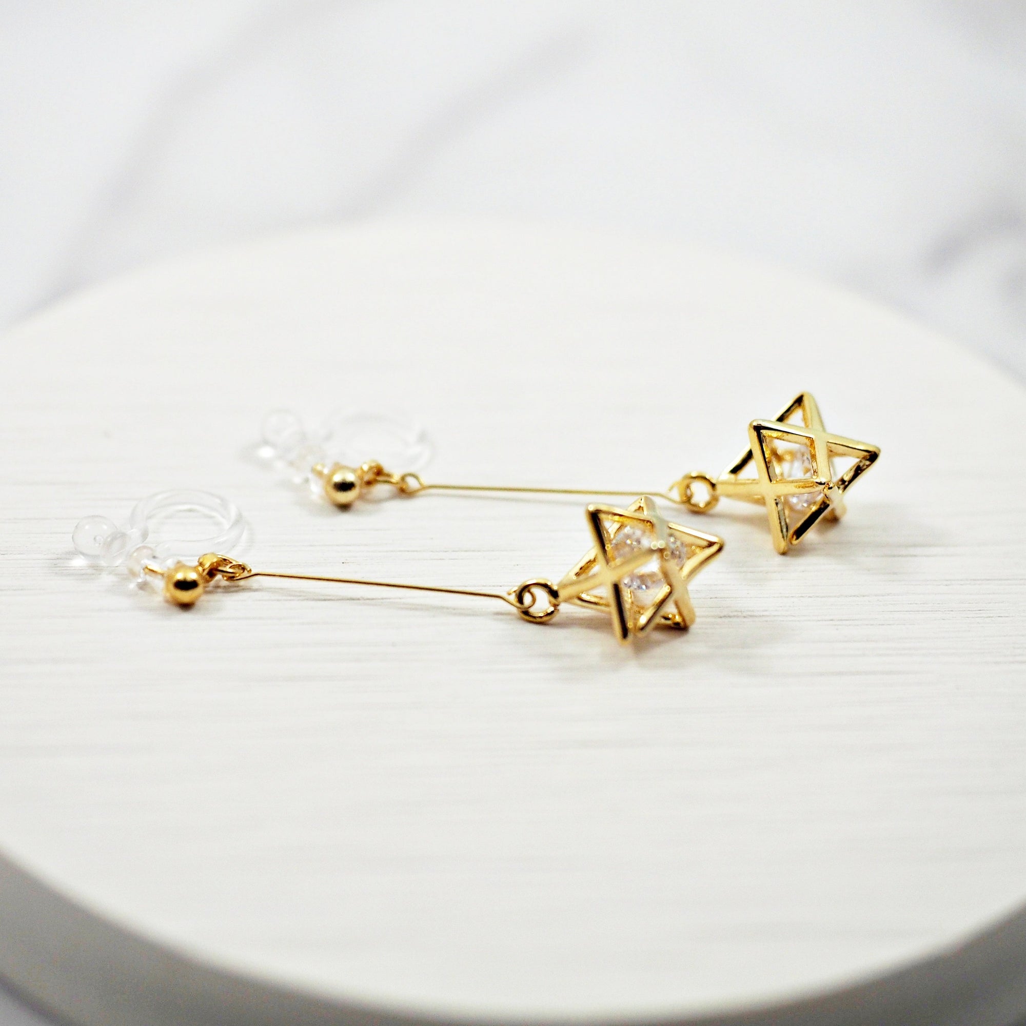 Dangle Crystal in Gold Star Invisible Clip On Earrings