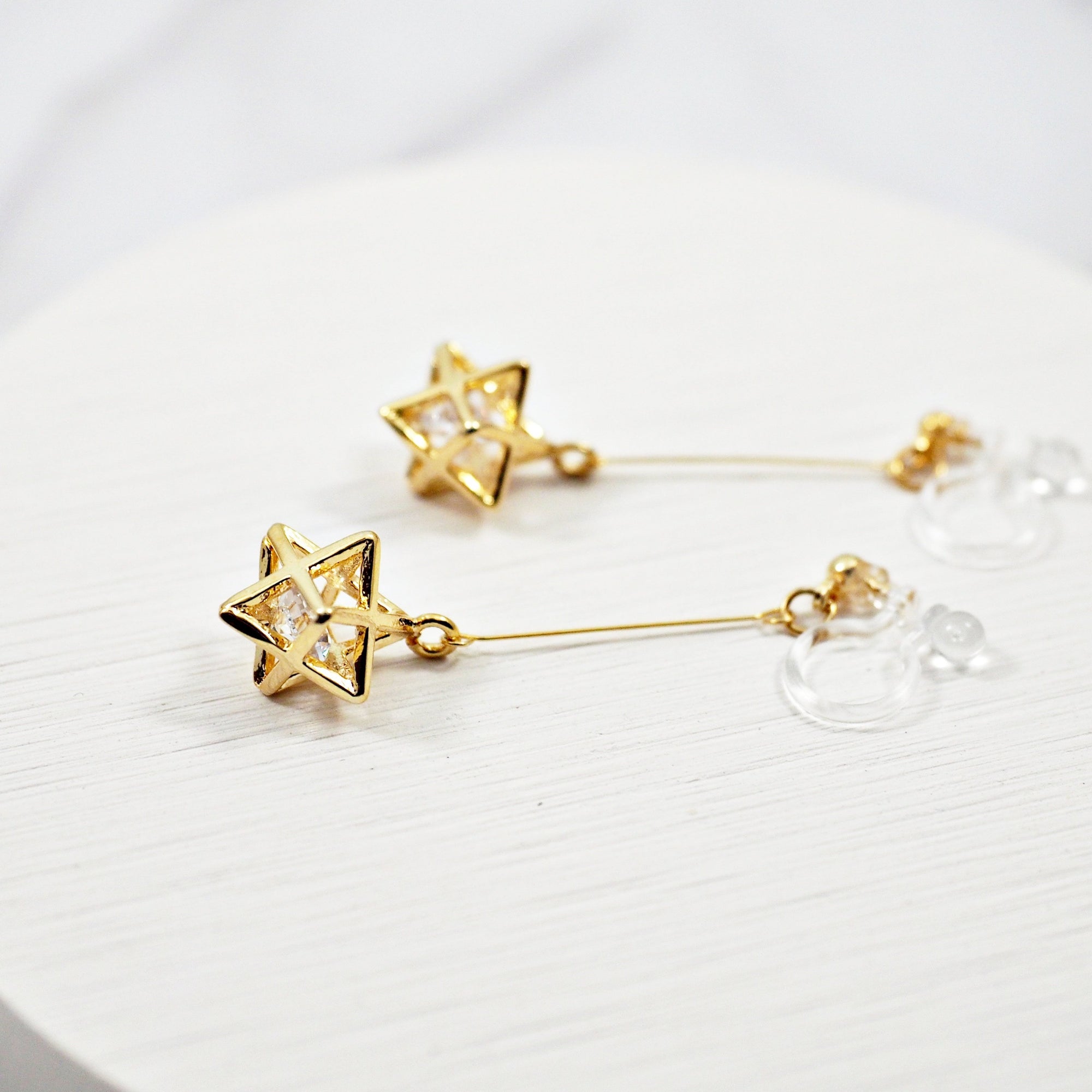 Dangle Crystal in Gold Star Invisible Clip On Earrings