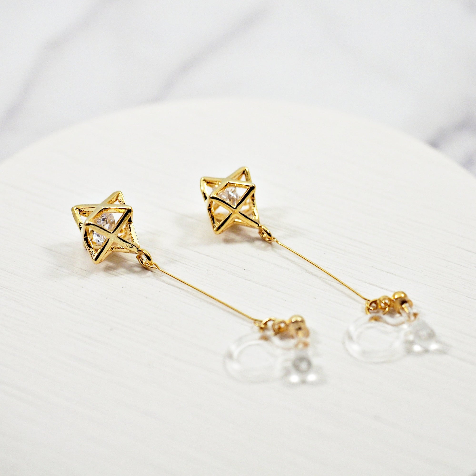 Dangle Crystal in Gold Star Invisible Clip On Earrings