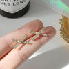 Crystal Rhinestone Pave Gold Cross Invisible Clip On Earrings