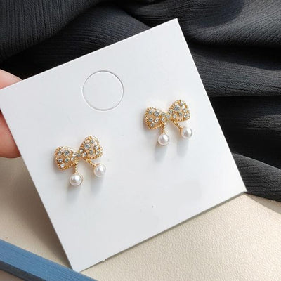 White Pearl Ribbon Bow Tie Crystal Rhinestone Pave Invisible Clip On Earrings