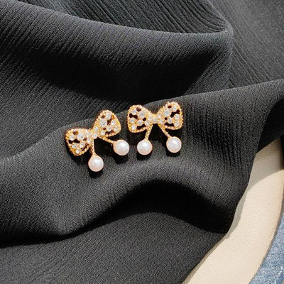 White Pearl Ribbon Bow Tie Crystal Rhinestone Pave Invisible Clip On Earrings