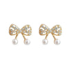 White Pearl Ribbon Bow Tie Crystal Rhinestone Pave Invisible Clip On Earrings