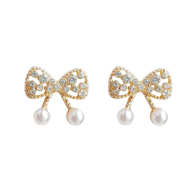 White Pearl Ribbon Bow Tie Crystal Rhinestone Pave Invisible Clip On Earrings
