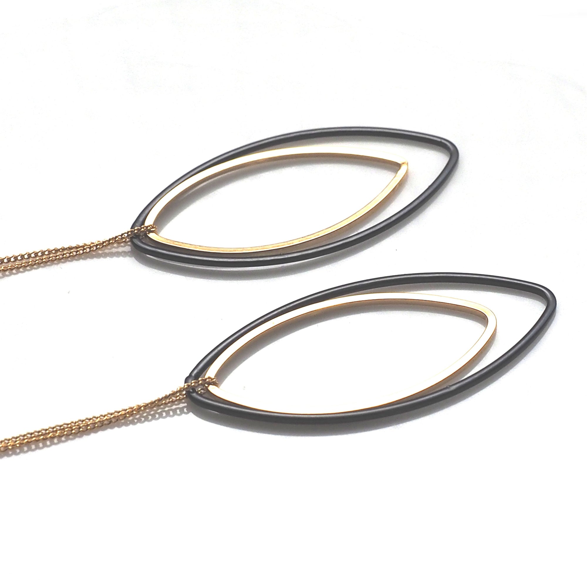 Long gold and black oval hoop invisible clip on earrings - miyabigracejewelry.com