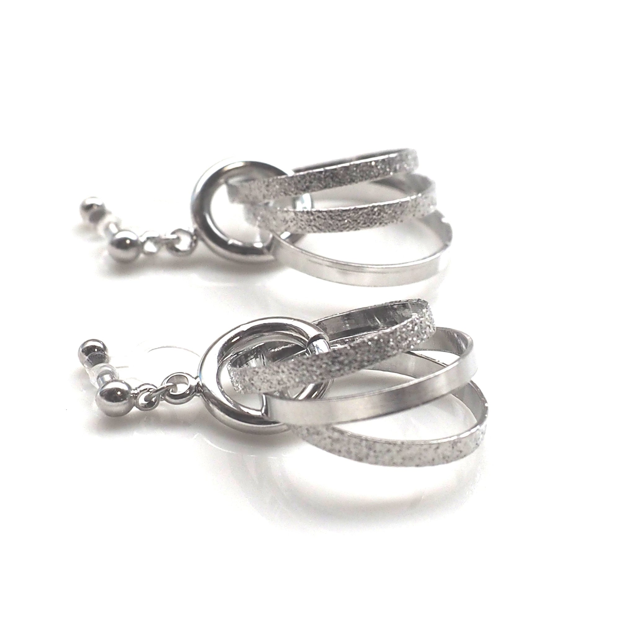 Three metallic silver rings invisible clip on earrings - miyabigracejewelry.com