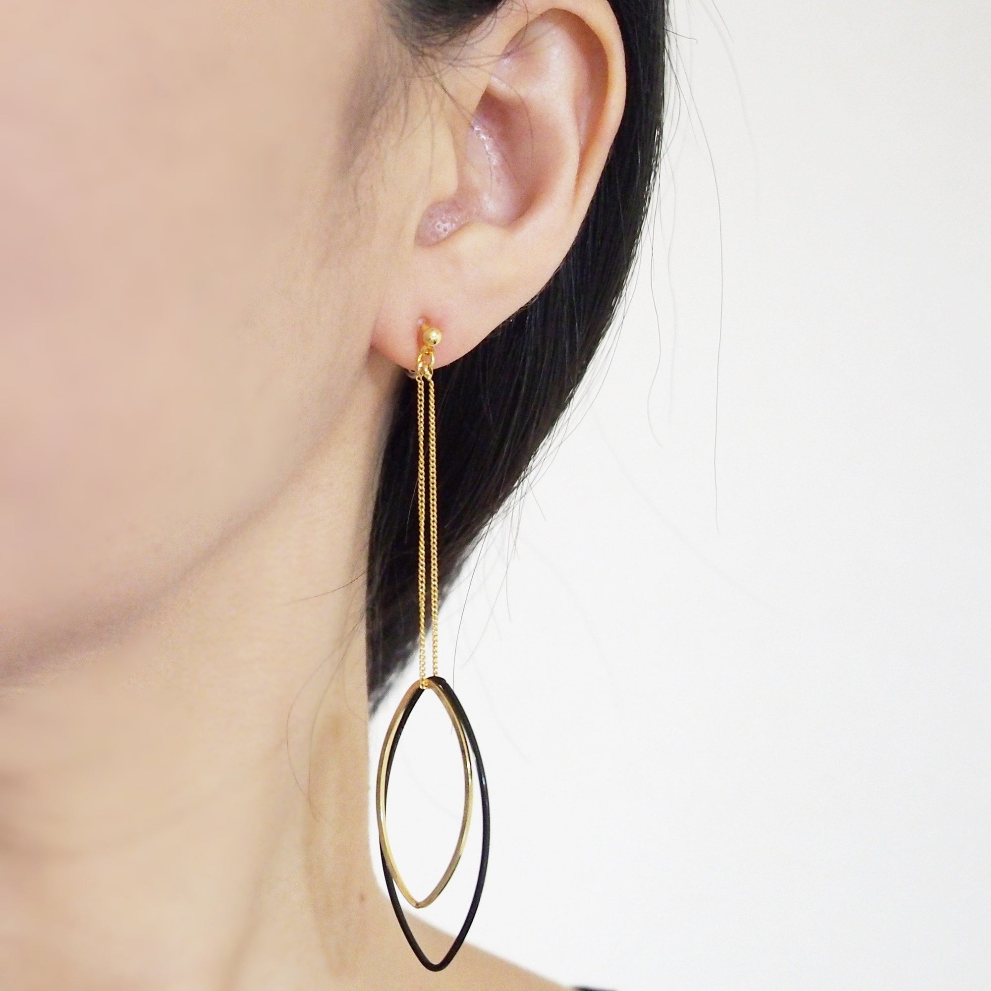 Long gold and black oval hoop invisible clip on earrings - miyabigracejewelry.com