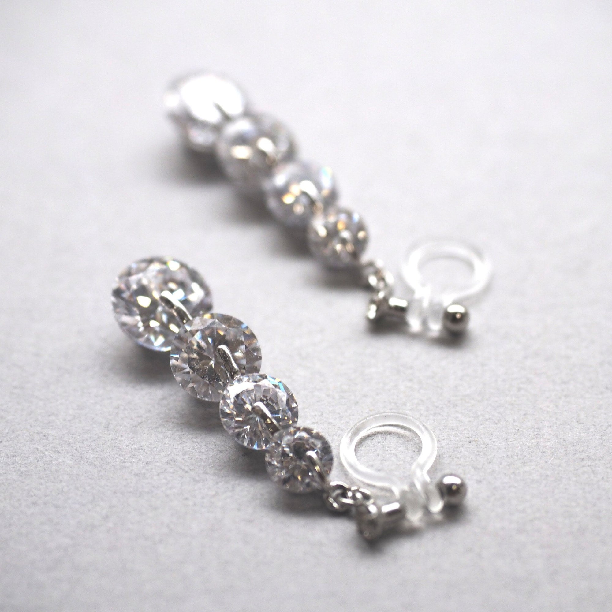 Gradated cubic zirconia invisible clip on earrings - miyabigracejewelry.com